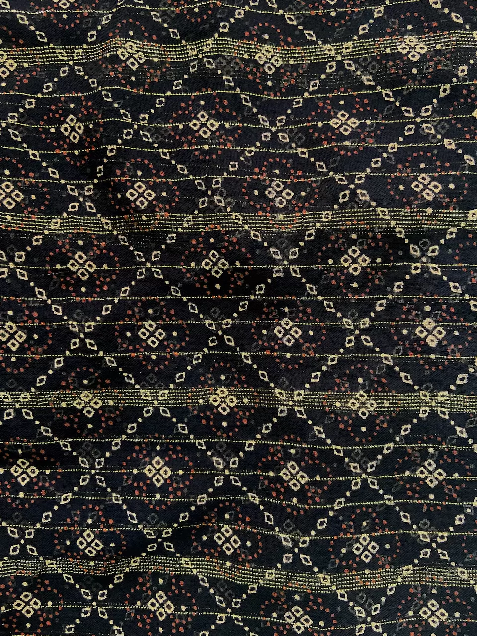 Gold Zari Weaving In Abstract with Bandhani Print in Black Georgette