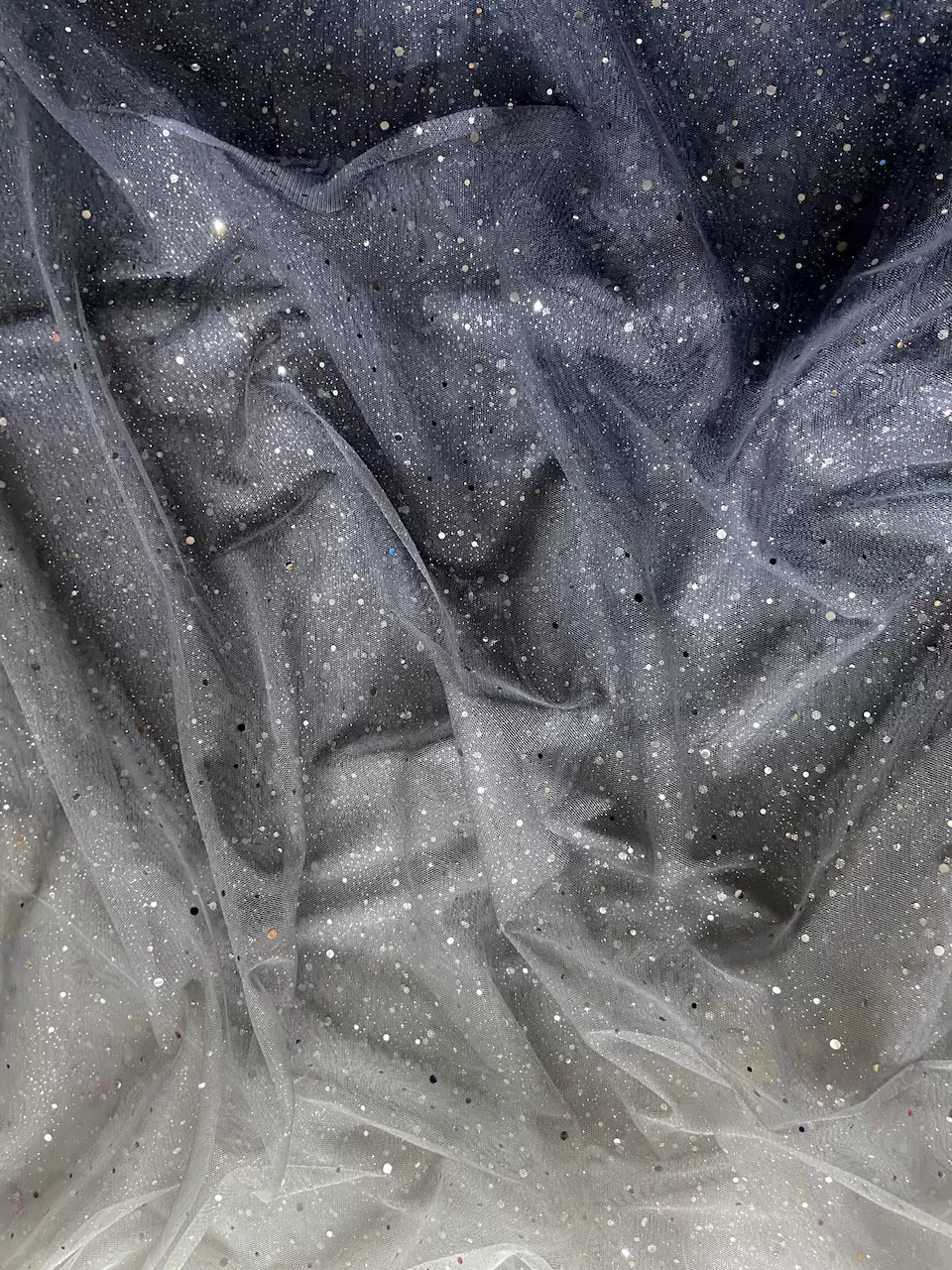 White To Grey Shaded Net Fabric With Silver Tikki All Over