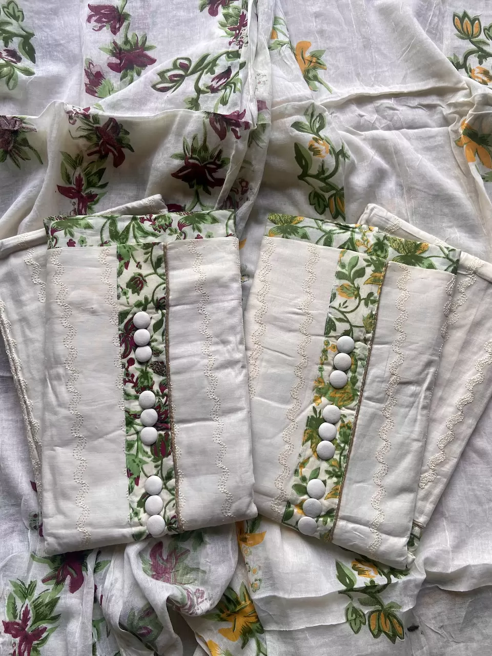 All over leaf printed bottom with leaf printed patch on the top on Cream Pure Cotton Suitpiece