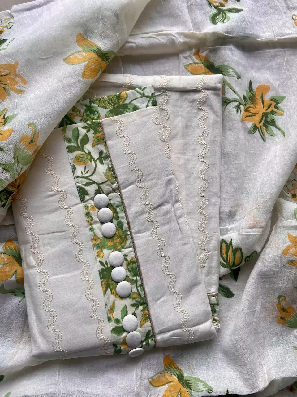 All over leaf printed bottom with leaf printed patch on the top on Cream Pure Cotton Suitpiece