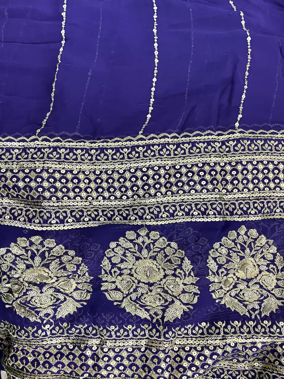 Gold Sequin Embroidery With Heavy Border On Purple Georgette Fabric