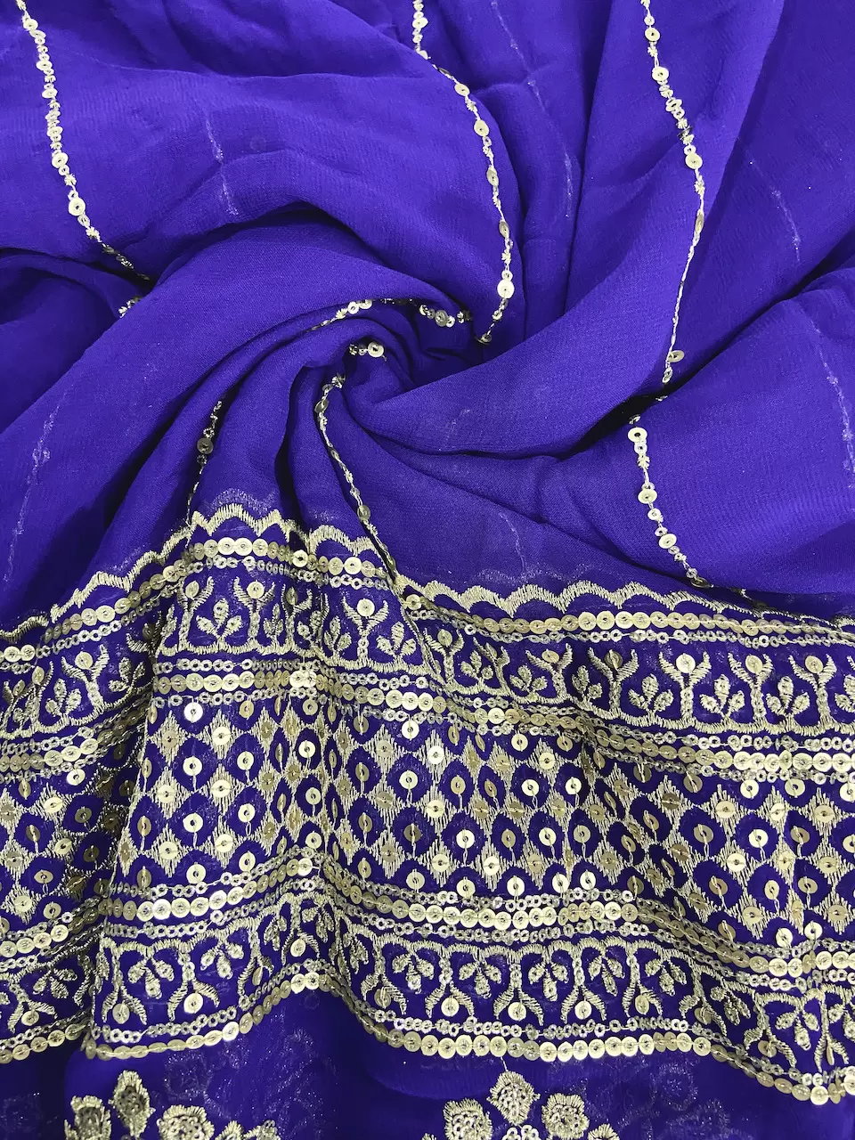 Gold Sequin Embroidery With Heavy Border On Purple Georgette Fabric