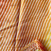 Orange Yellow Multi Leheriya Print On Chinnon Fabric