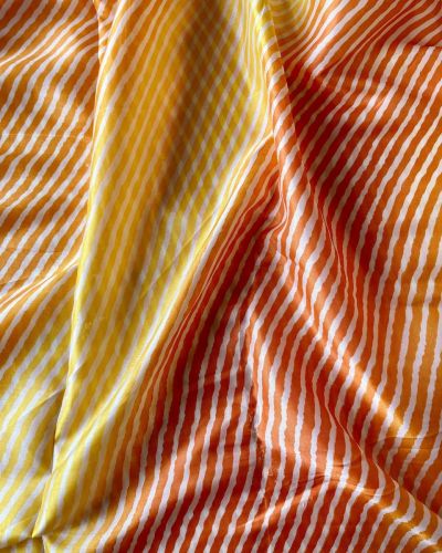 Orange Yellow Multi Leheriya Print On Chinnon Fabric