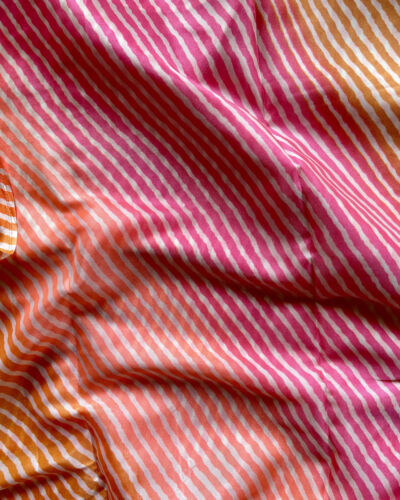 Pink Orange Peach Multi Leheriya Print On Chinnon Fabric