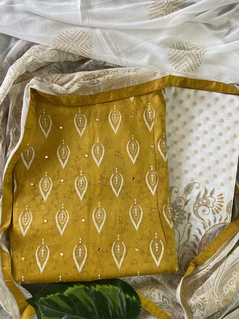 Ochre yellow pure cotton unstitched suit with off white chiffon dupatta