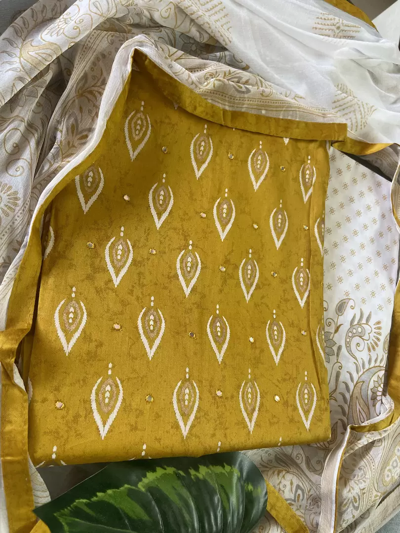Ochre yellow pure cotton unstitched suit with off white chiffon dupatta