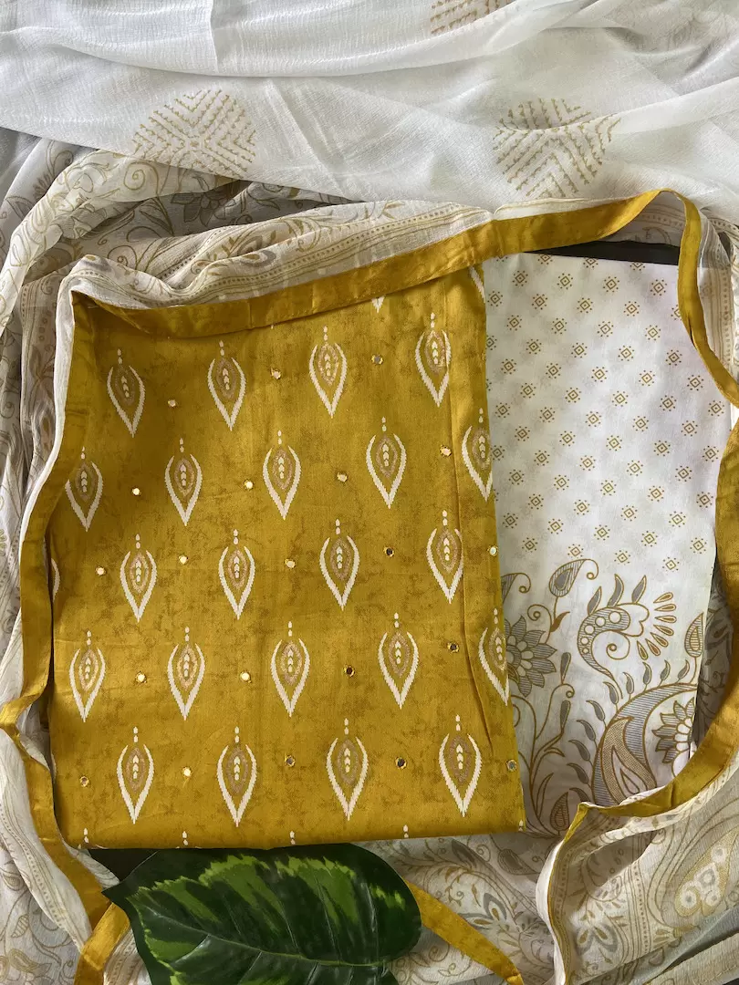 Ochre yellow pure cotton unstitched suit with off white chiffon dupatta