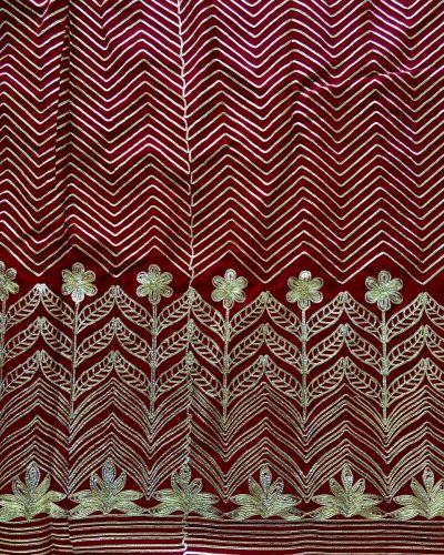 All Over Gota Work In Zig Zag Pattern With Heavy Floral Border On Maroon Georgette Fabric