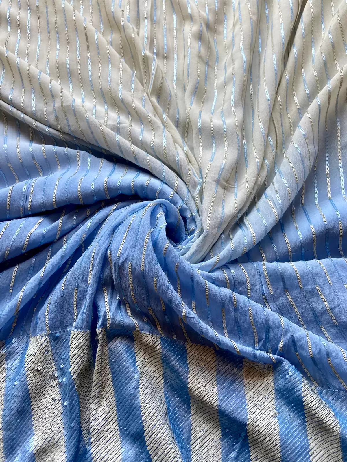 All Over Sequin Stripes & Heavy Sequin Work On Border On Creme To Powder Blue Shaded Pure Georgette Fabric