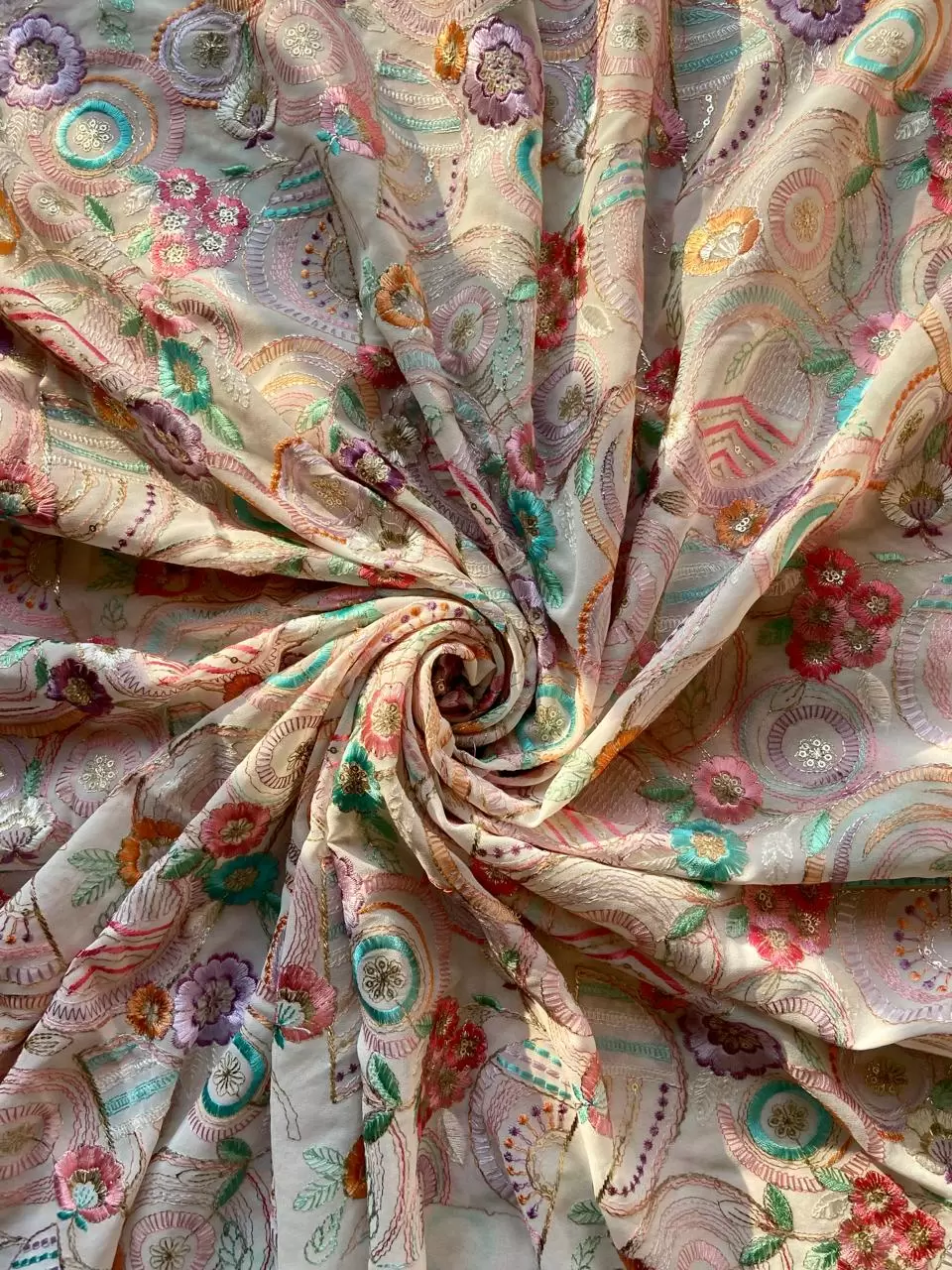 Exclusive All Over Multicoloured Thread Work Embroidery In Circular & Floral Pattern On Off White Georgette Fabric