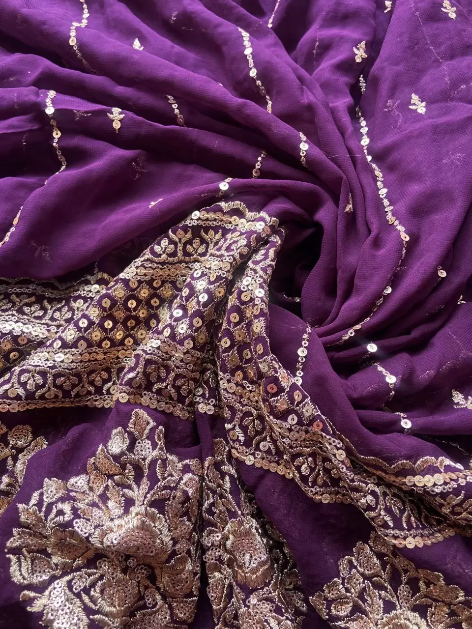 GOLD SEQUIN EMBROIDERY WITH HEAVY BORDER ON WINE GEORGETTE FABRIC