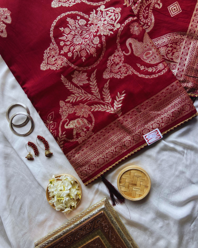 Maroon silk saree with golden print work