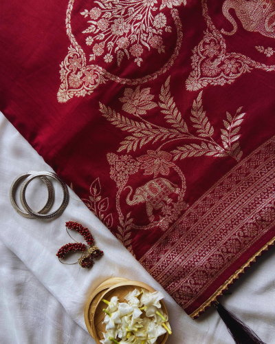 Maroon silk saree with golden print work