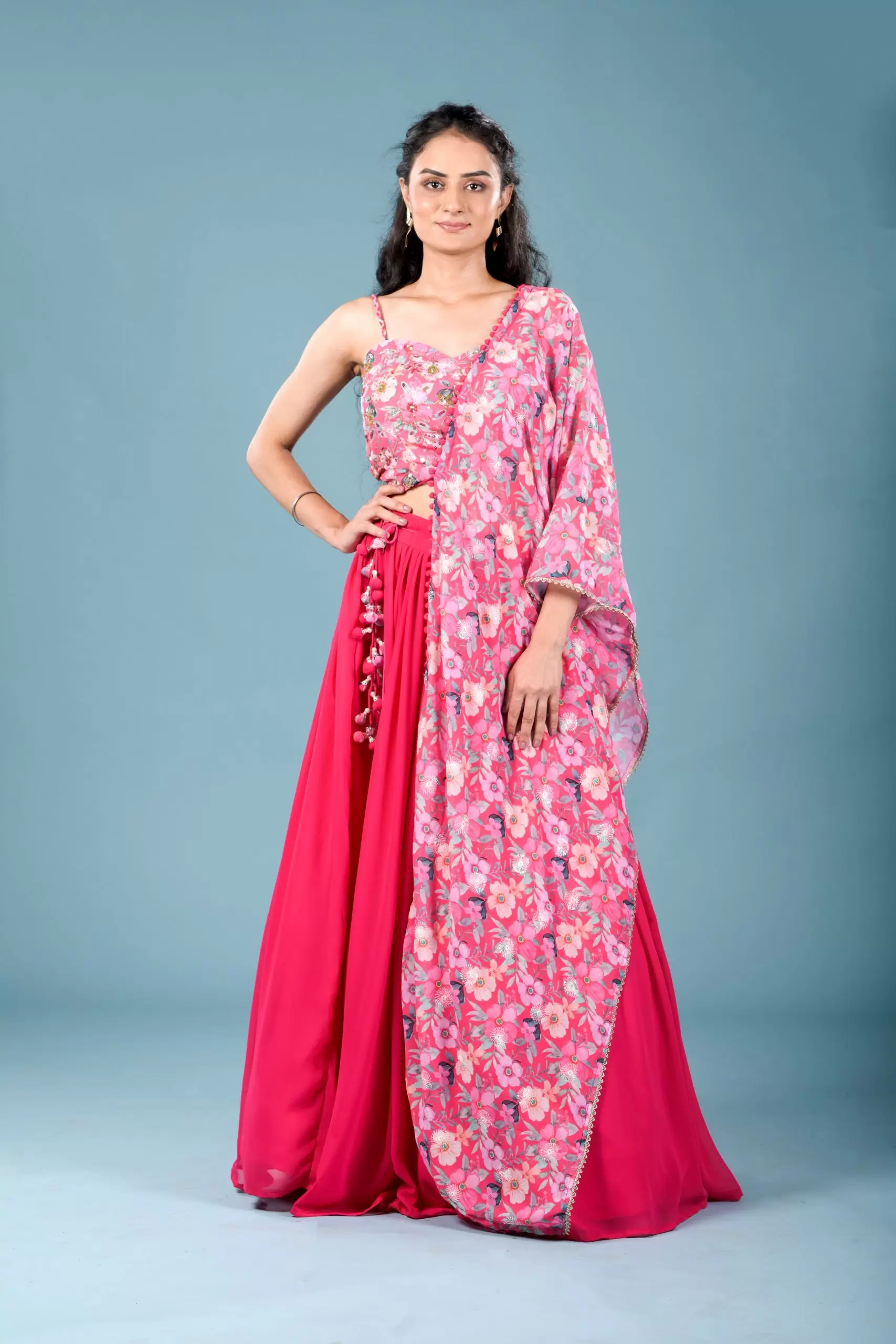 Gulnar Flared Lehenga and Blouse set with Shrug style Dupatta and Tassel Detailings.