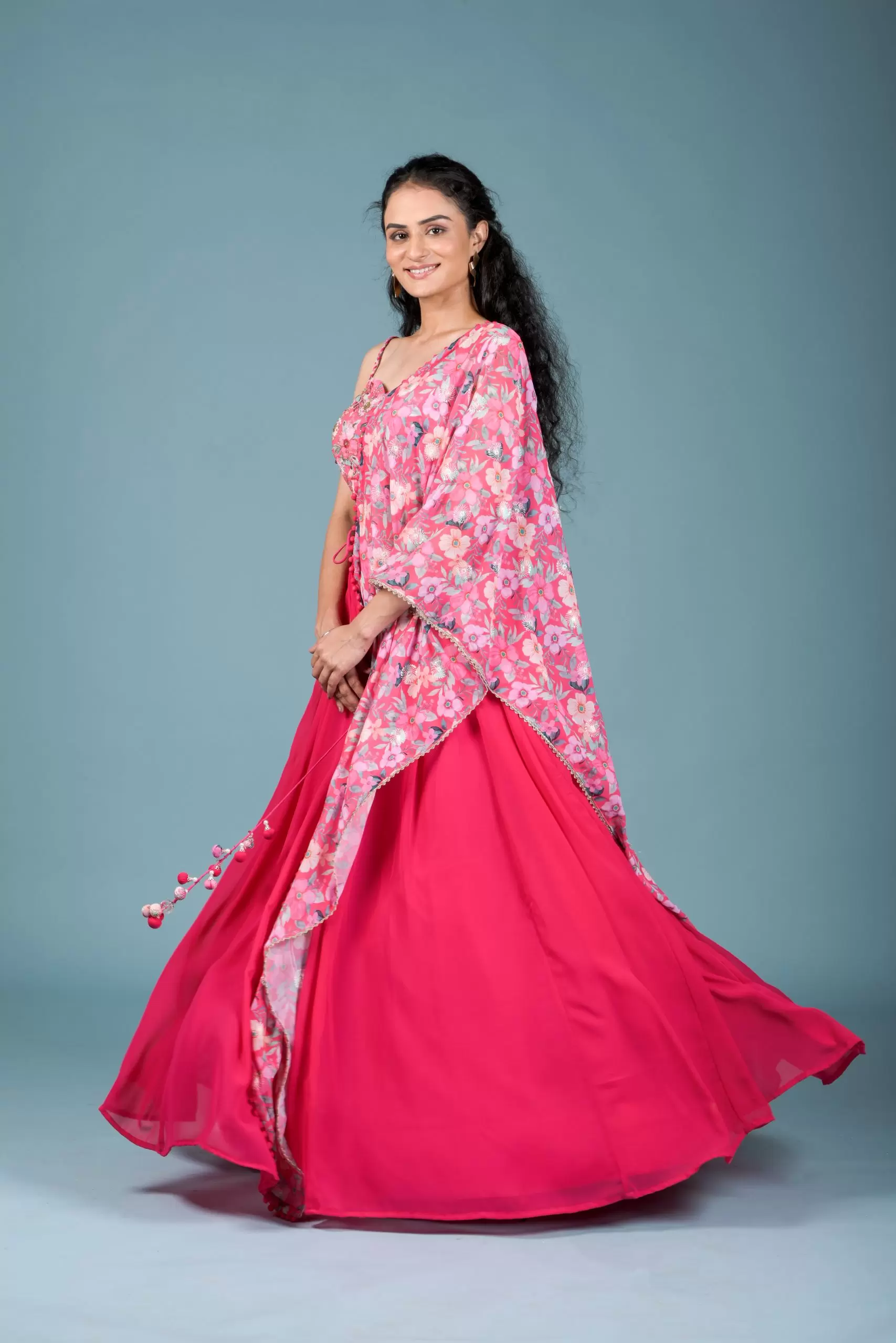 Gulnar Flared Lehenga and Blouse set with Shrug style Dupatta and Tassel Detailings.