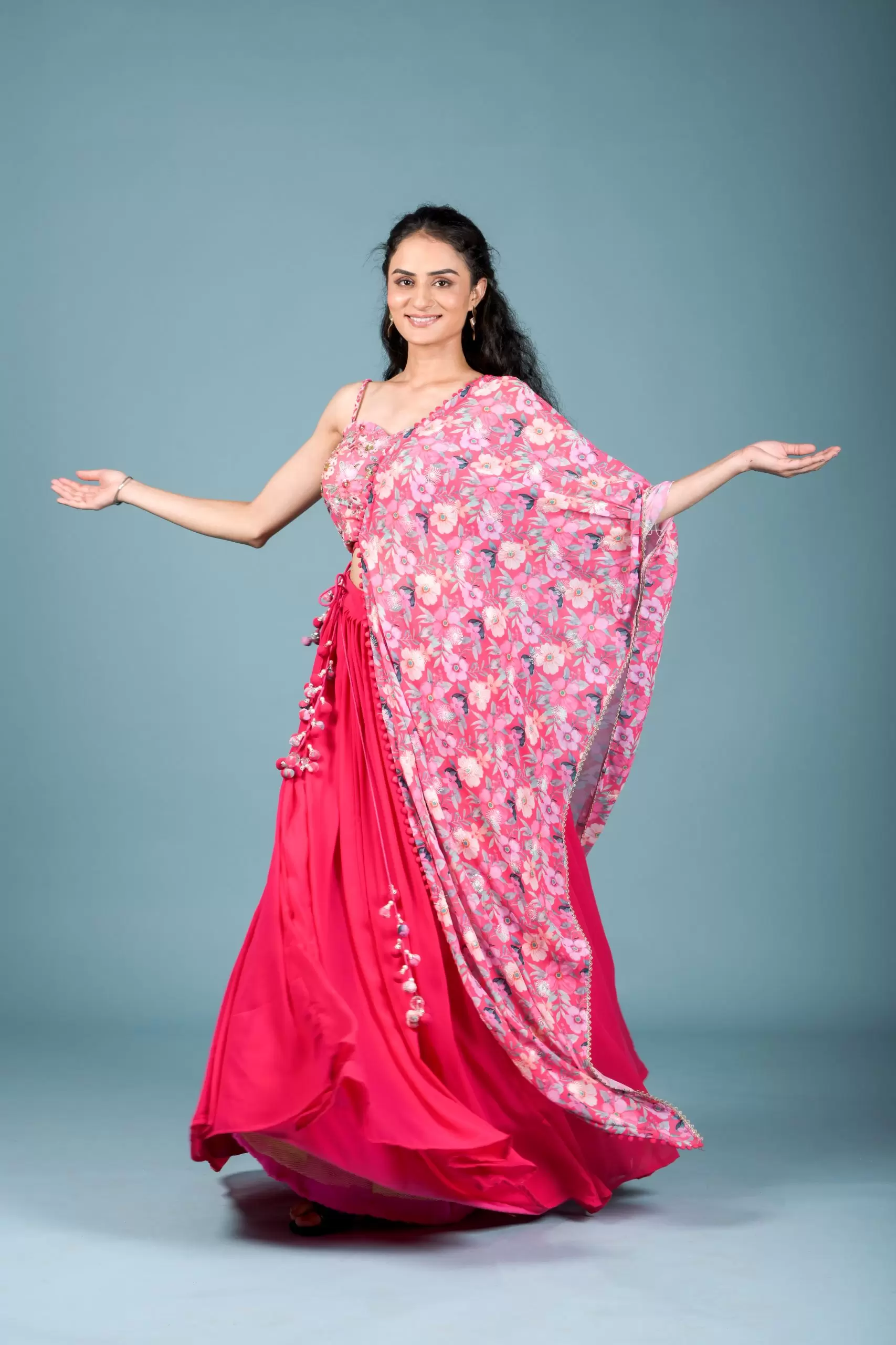 Gulnar Flared Lehenga and Blouse set with Shrug style Dupatta and Tassel Detailings.