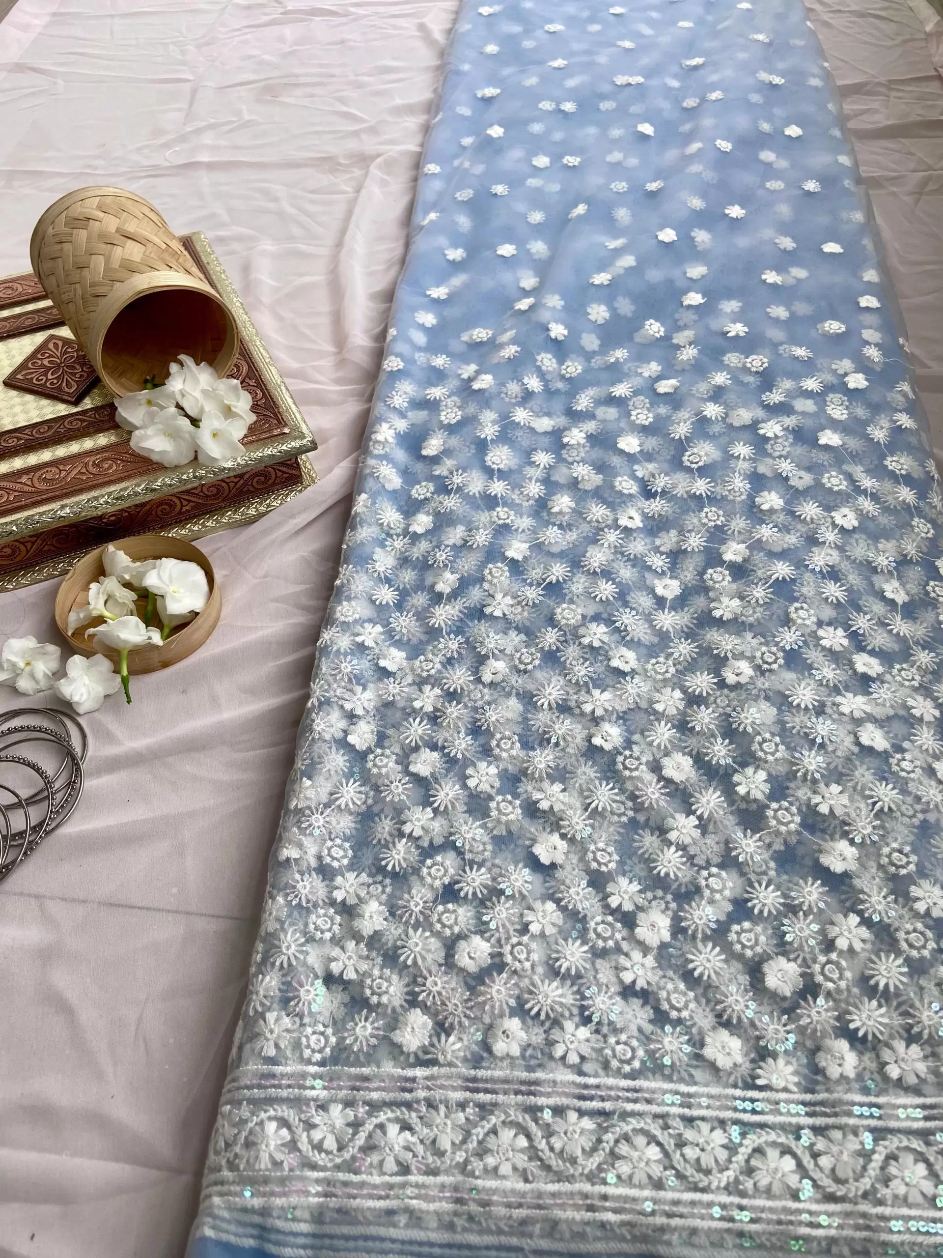 All over floral white thread work on cyan blue big width net fabric