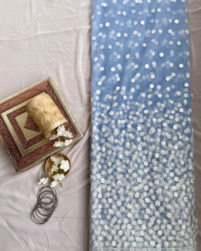 All over floral white thread work on cyan blue big width net fabric