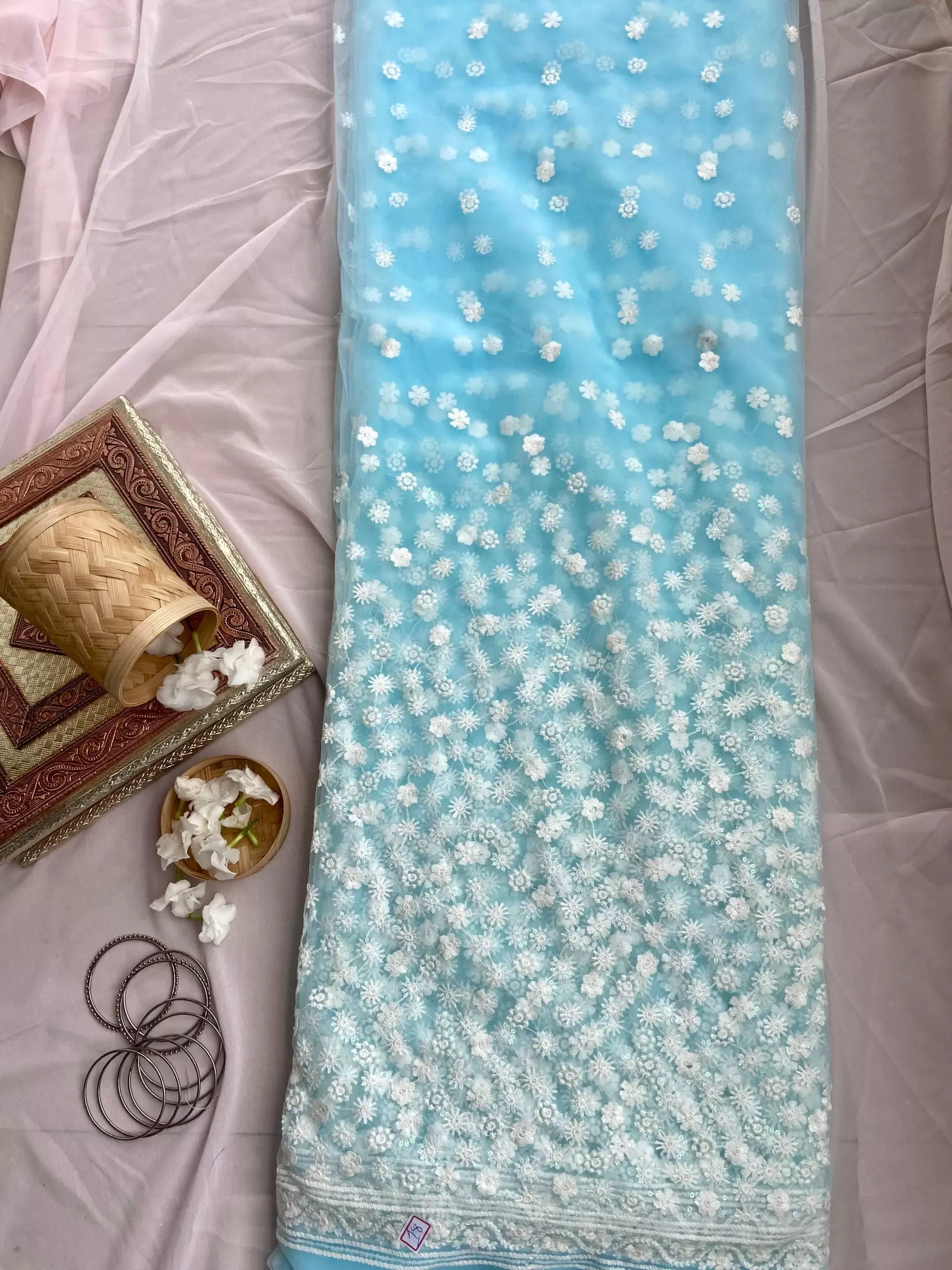 All over floral white thread work on azure sky blue big width net fabric