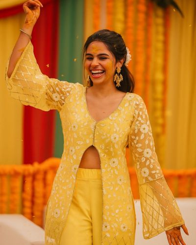 Pastel yellow Co ord set with Bell Bottom Pants and cut detailling in the Front