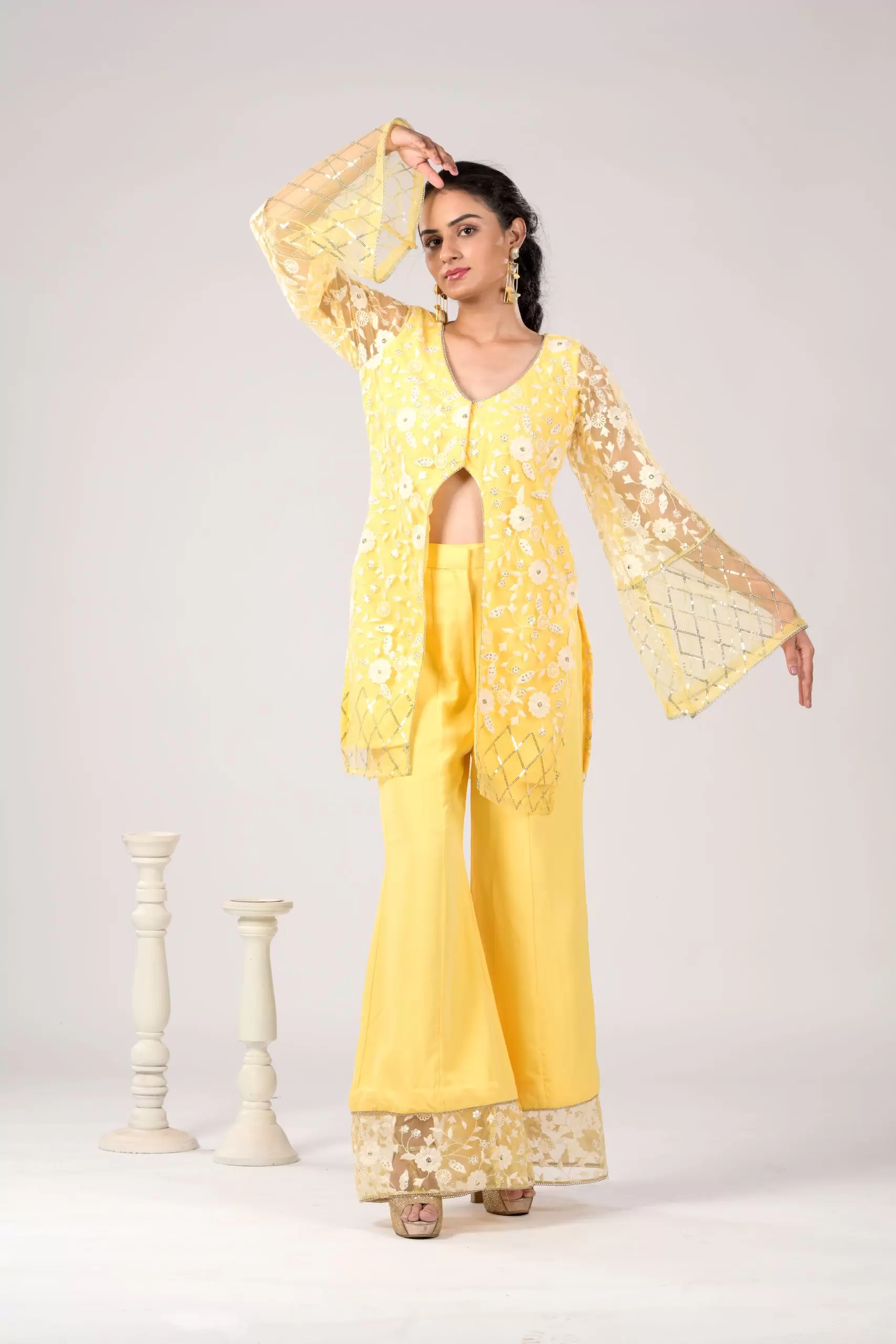 Pastel yellow Co ord set with Bell Bottom Pants and cut detailling in the Front