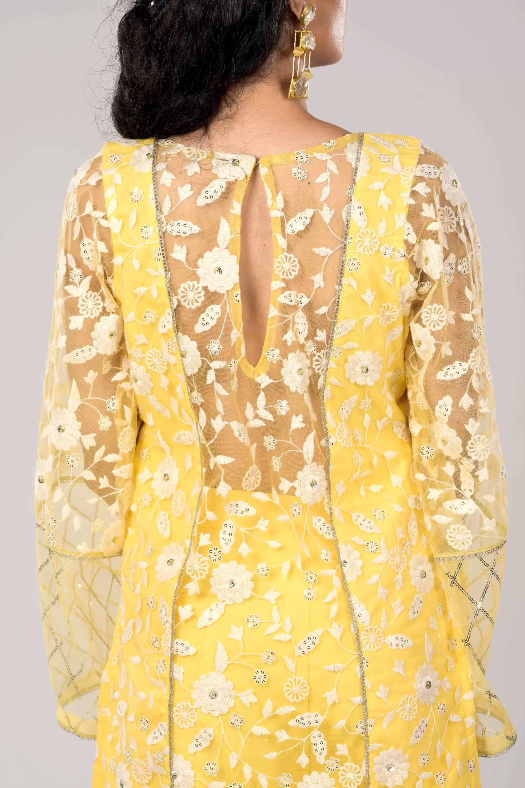 Pastel yellow Co ord set with Bell Bottom Pants and cut detailling in the Front