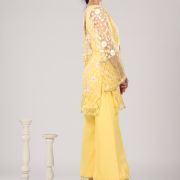 Pastel yellow Co ord set with Bell Bottom Pants and cut detailling in the Front