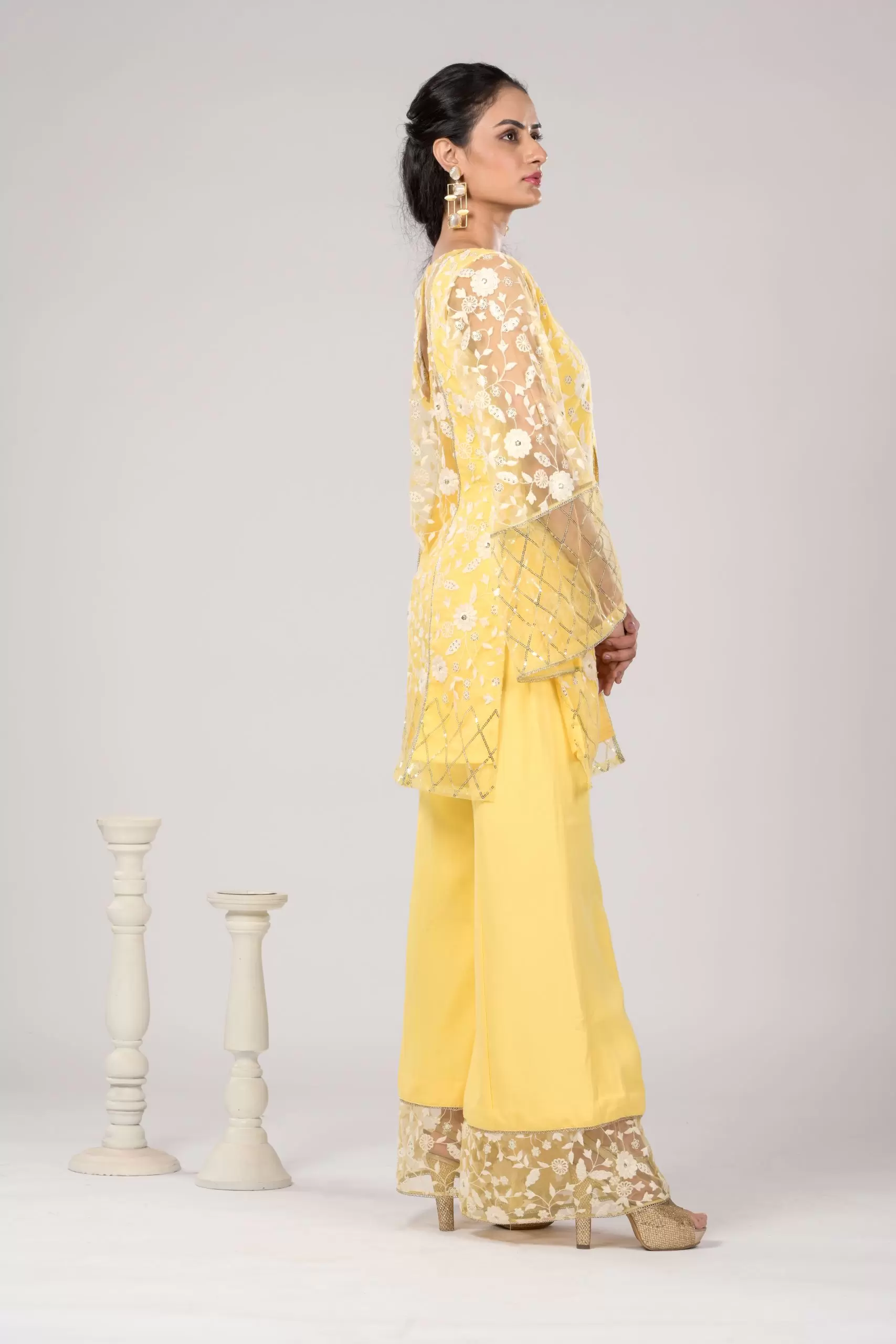 Pastel yellow Co ord set with Bell Bottom Pants and cut detailling in the Front
