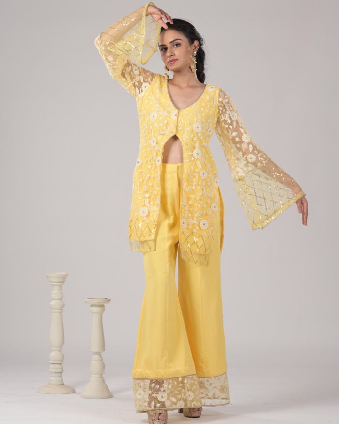 Pastel yellow Co ord set with Bell Bottom Pants and cut detailling in the Front