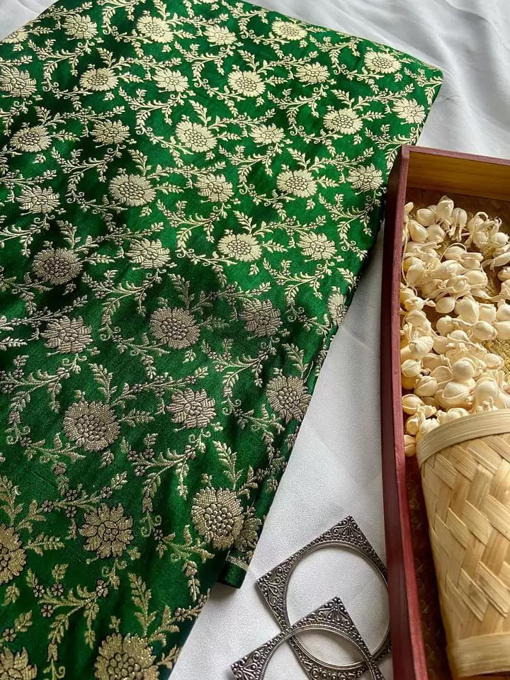 Golden floral motifs on green banarasi fabric