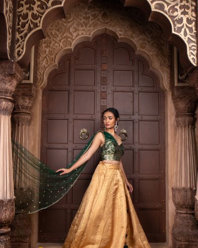 Tube Banarasi Emerald green blouse with Drape net Dupatta and Golden banarasi Skirt Set