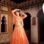 Rust orange pure cosmos tissue silk lehenga with heavy Embroidered jacket