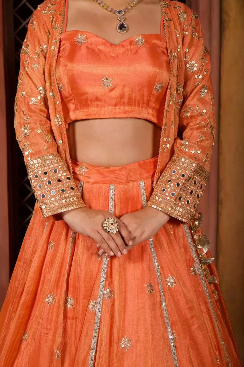 Rust orange pure cosmos tissue silk lehenga with heavy Embroidered jacket