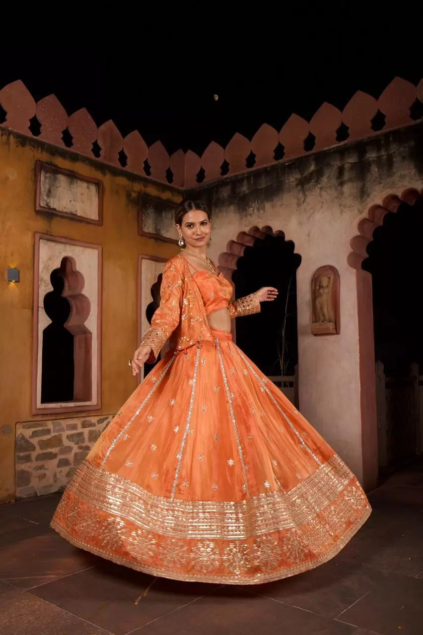 Rust orange pure cosmos tissue silk lehenga with heavy Embroidered jacket