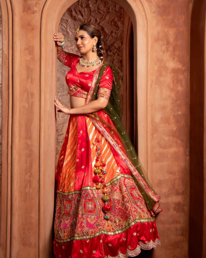 Orange & Red Kalidar Lehenga set with mehendi Green Dupatta