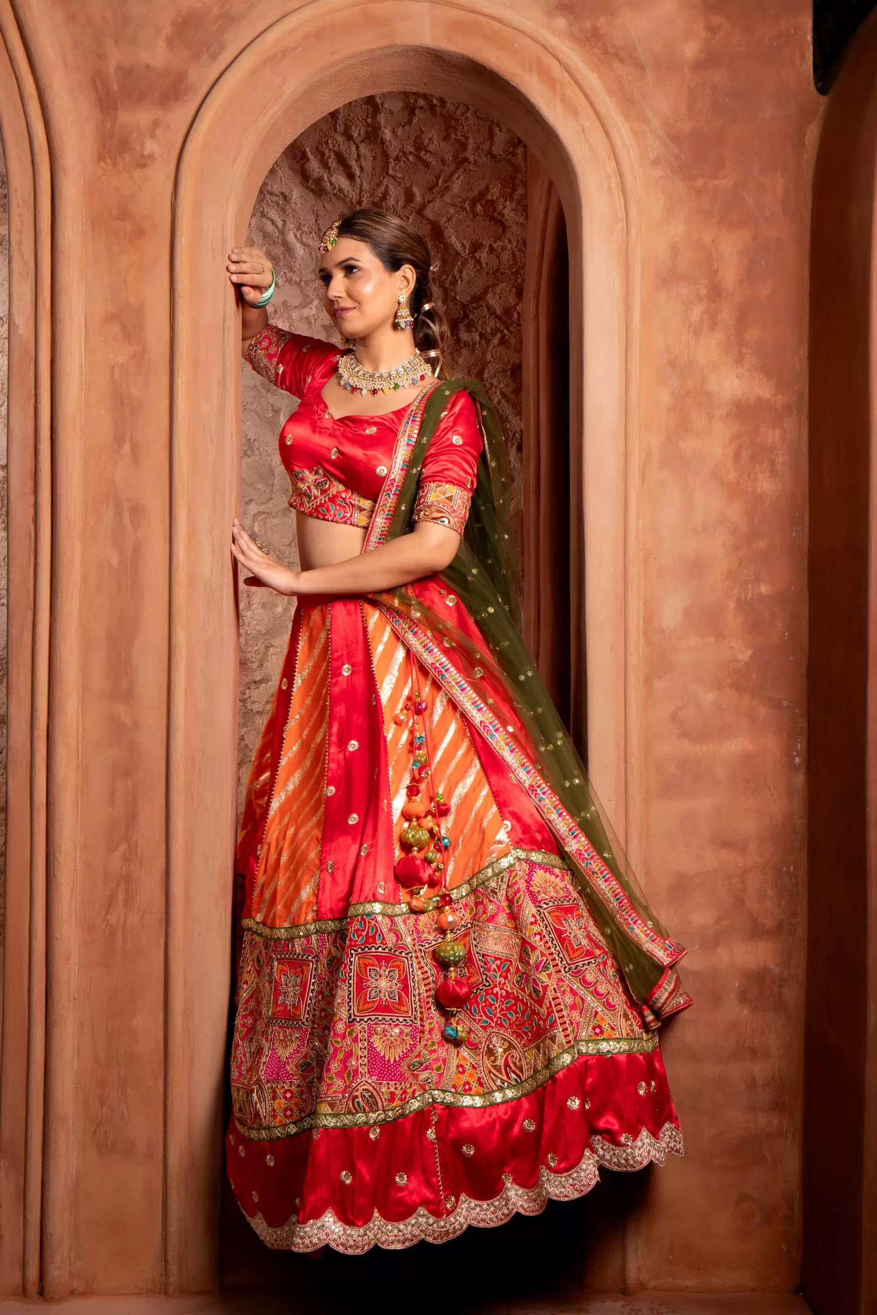 Orange & Red Kalidar Lehenga set with mehendi Green Dupatta