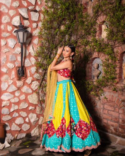 Ferozi blue and Yellow with Rani pink patch detailling Gherdaar lehenga