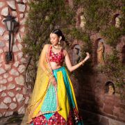 Ferozi blue and Yellow with Rani pink patch detailling Gherdaar lehenga