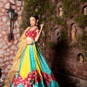 Ferozi blue and Yellow with Rani pink patch detailling Gherdaar lehenga