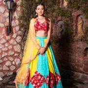 Ferozi blue and Yellow with Rani pink patch detailling Gherdaar lehenga