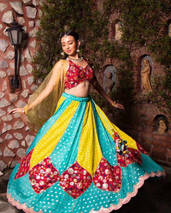 Ferozi blue and Yellow with Rani pink patch detailling Gherdaar lehenga