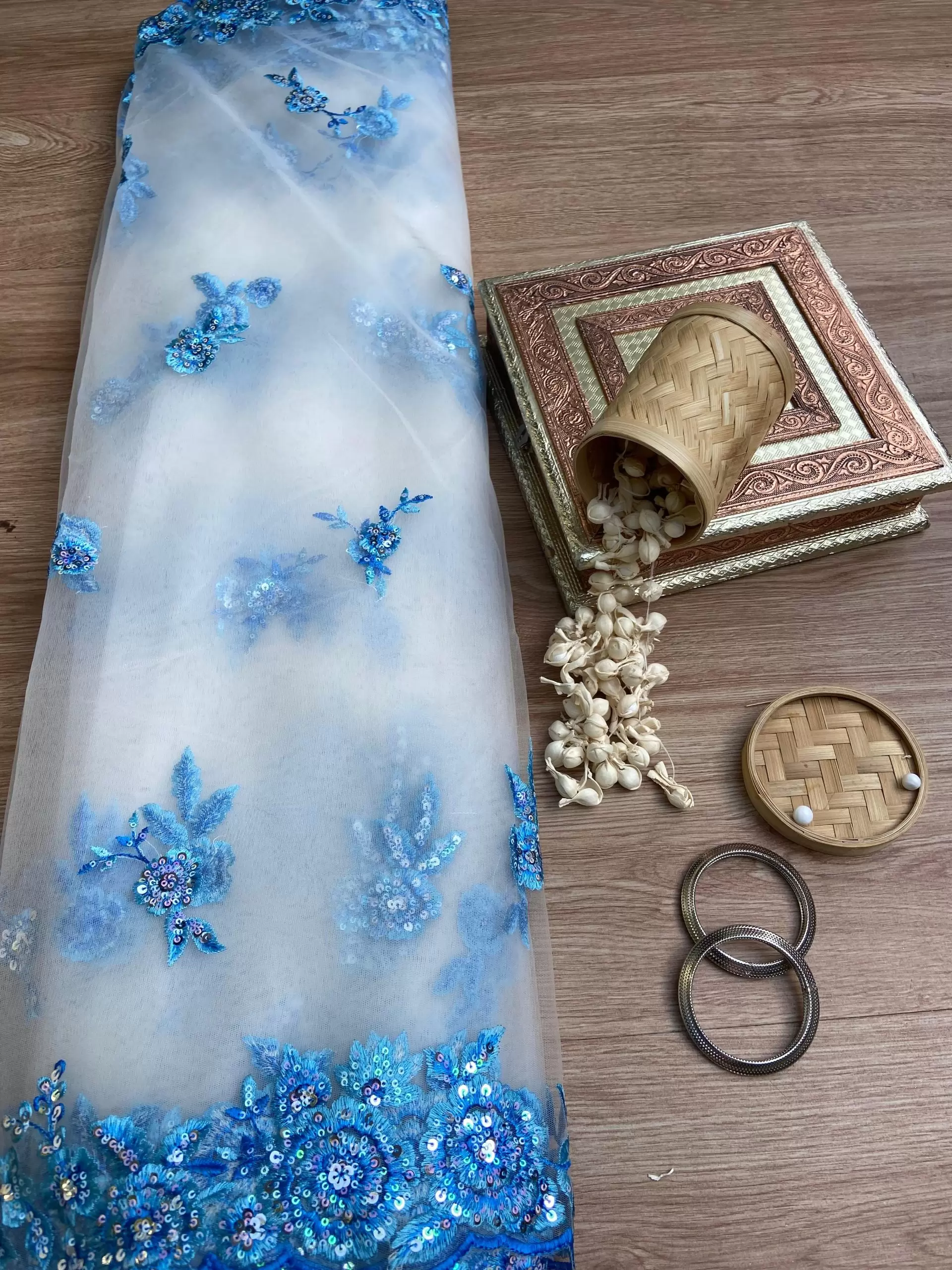 Blue thread and sequin floral embroidery border on net fabric dupatta