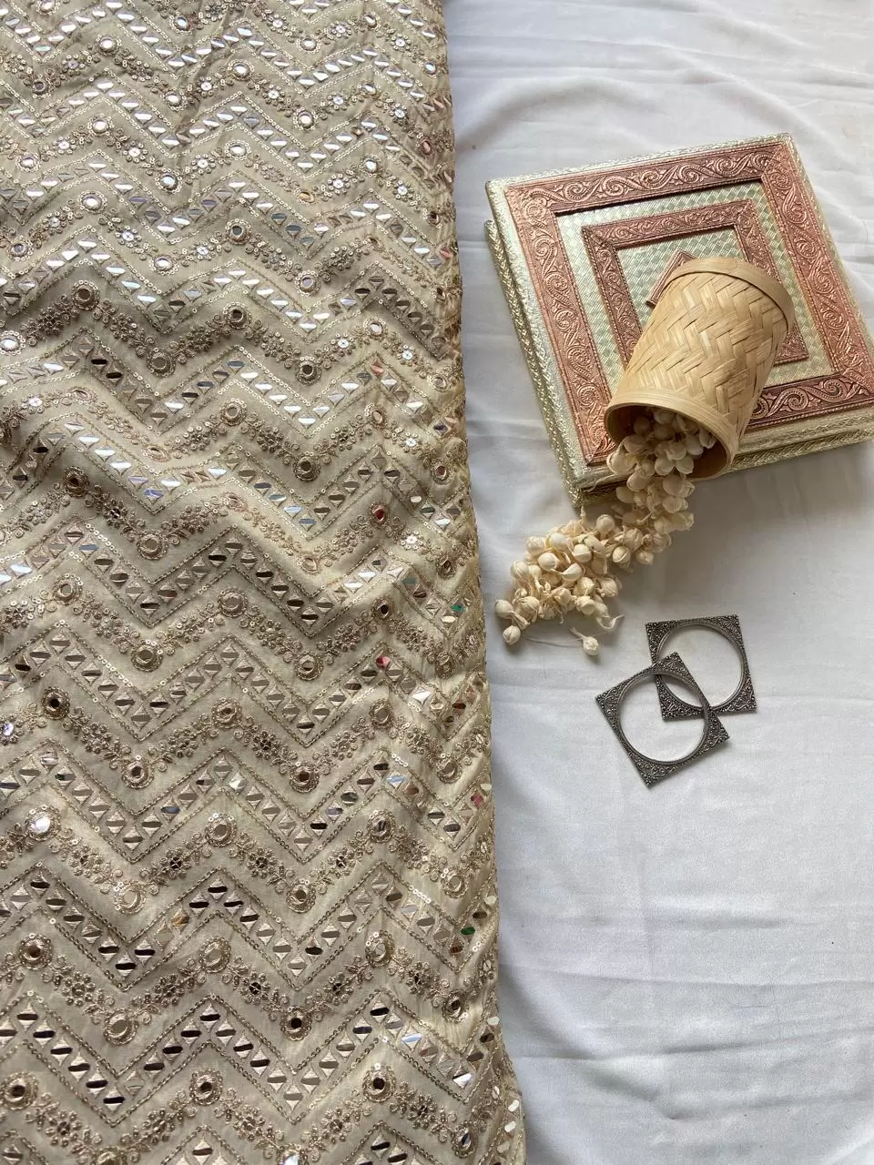 Heavy mirror and sequin embroidery in zig zag on golden cosmos tissue silk fabric