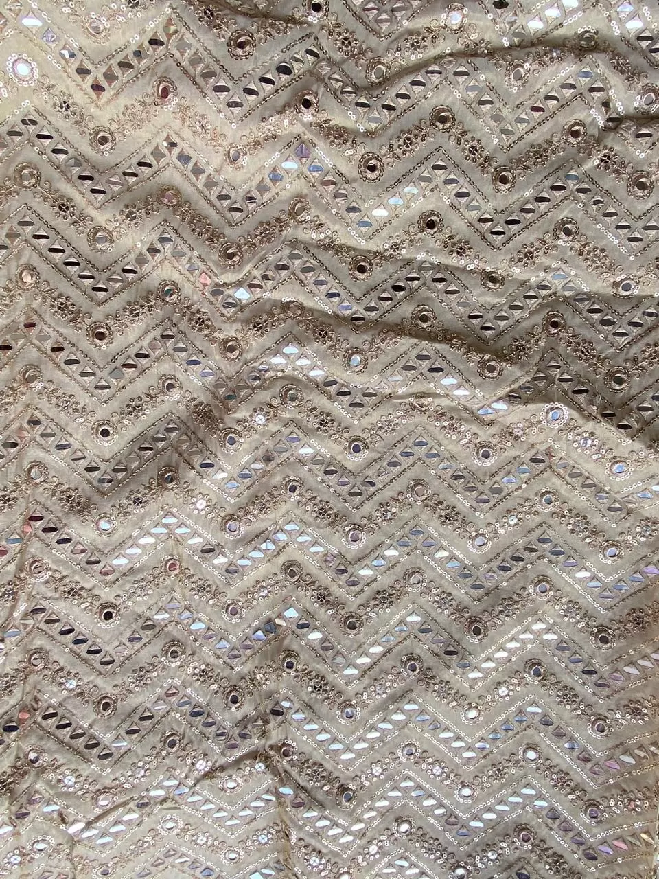 Heavy mirror and sequin embroidery in zig zag on golden cosmos tissue silk fabric