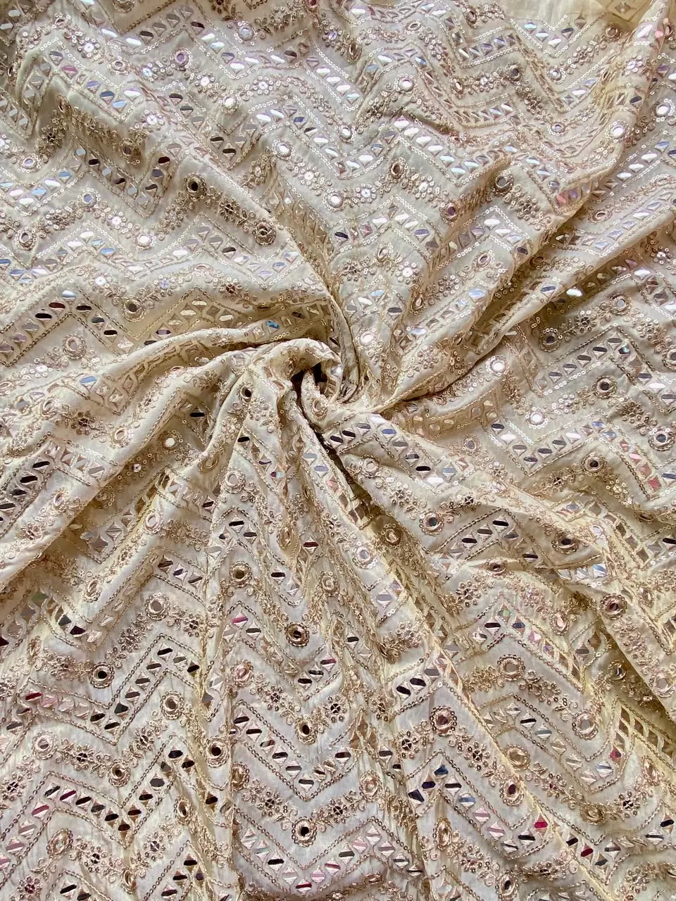 Heavy mirror and sequin embroidery in zig zag on golden cosmos tissue silk fabric