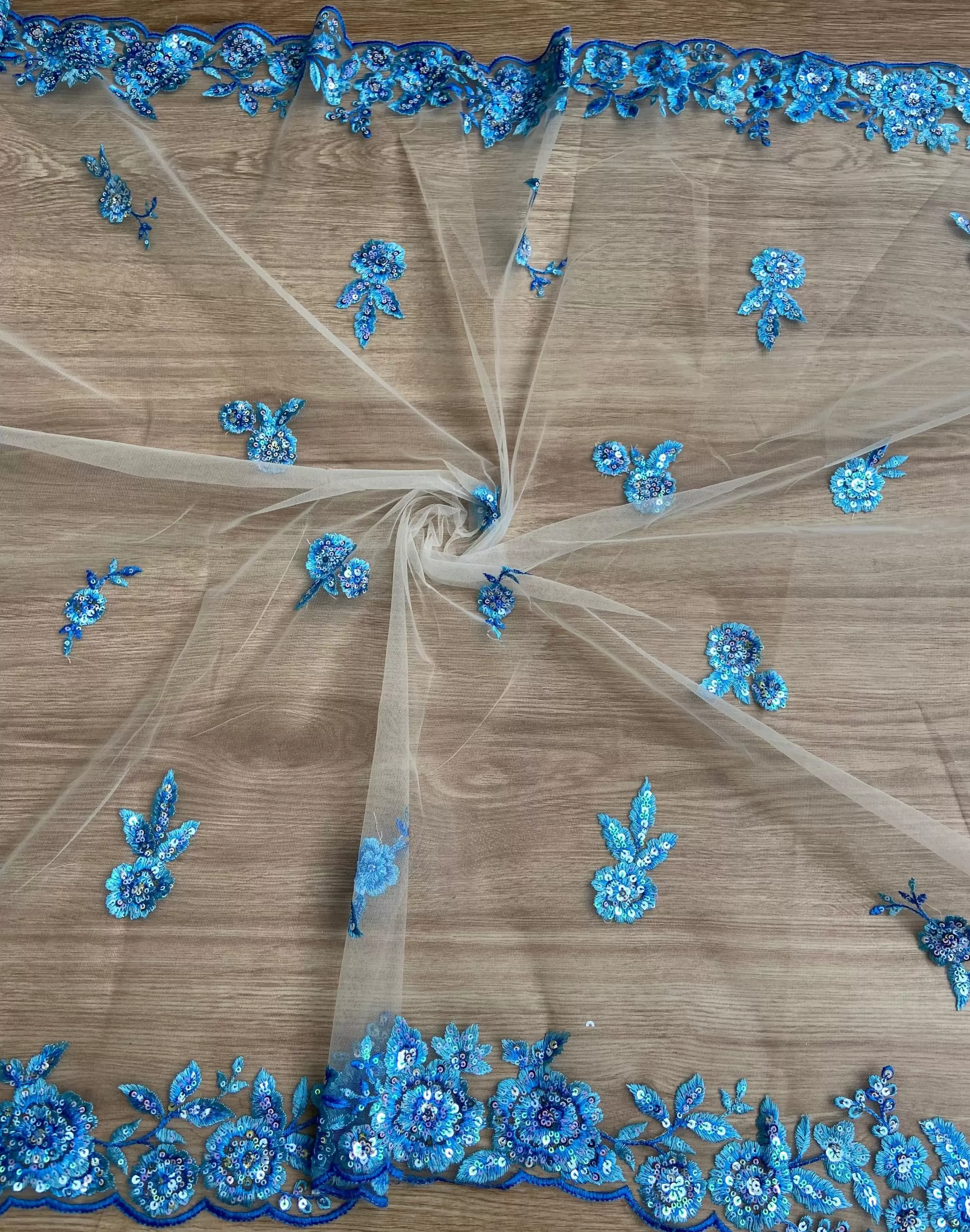 Blue thread and sequin floral embroidery border on net fabric dupatta