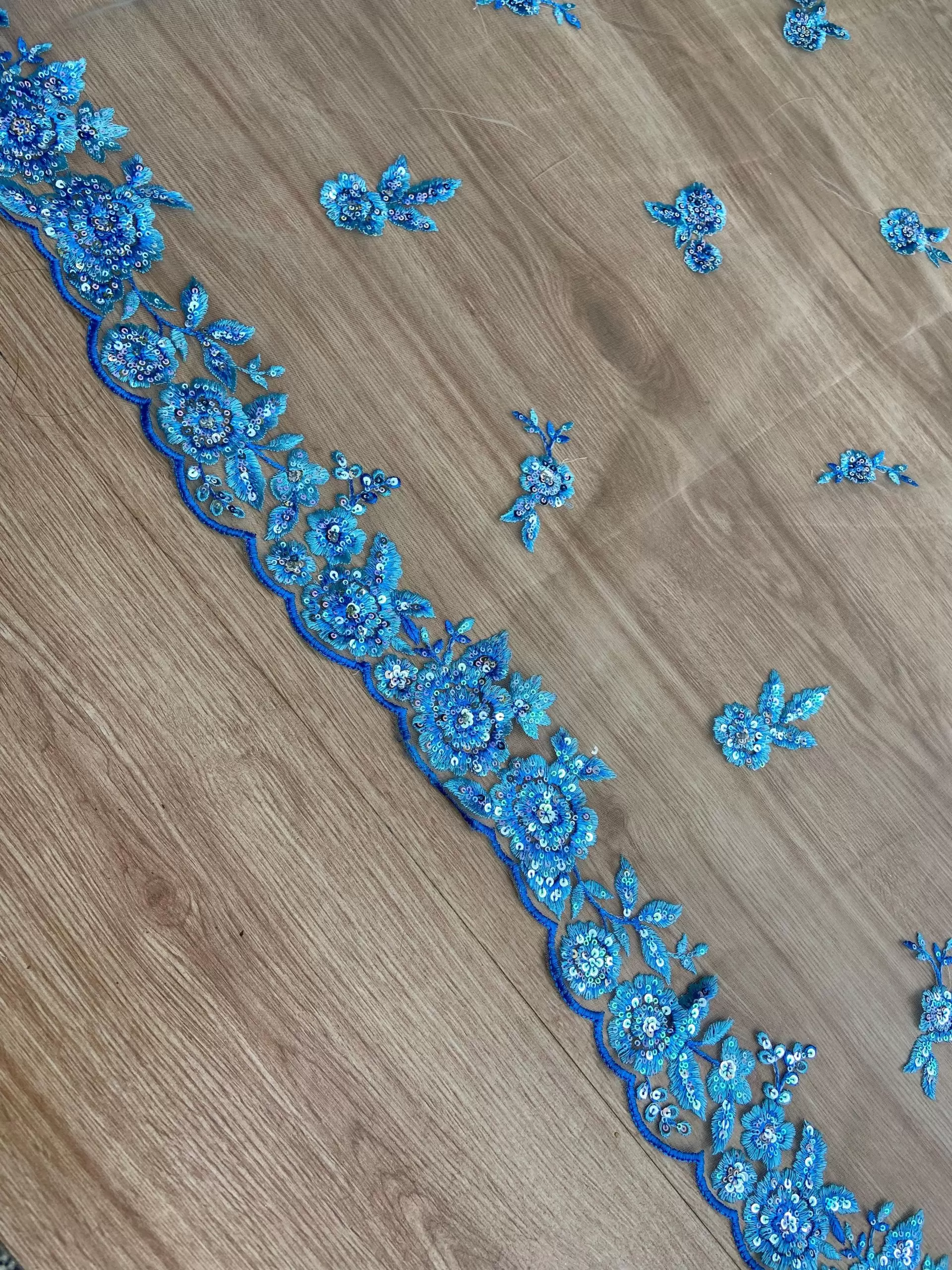 Blue thread and sequin floral embroidery border on net fabric dupatta