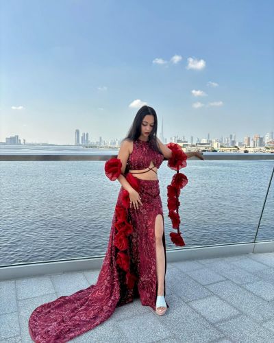 Wine Trail Skirt And a Halter Blouse With Slit Details And a Beautiful Rose Dupatta