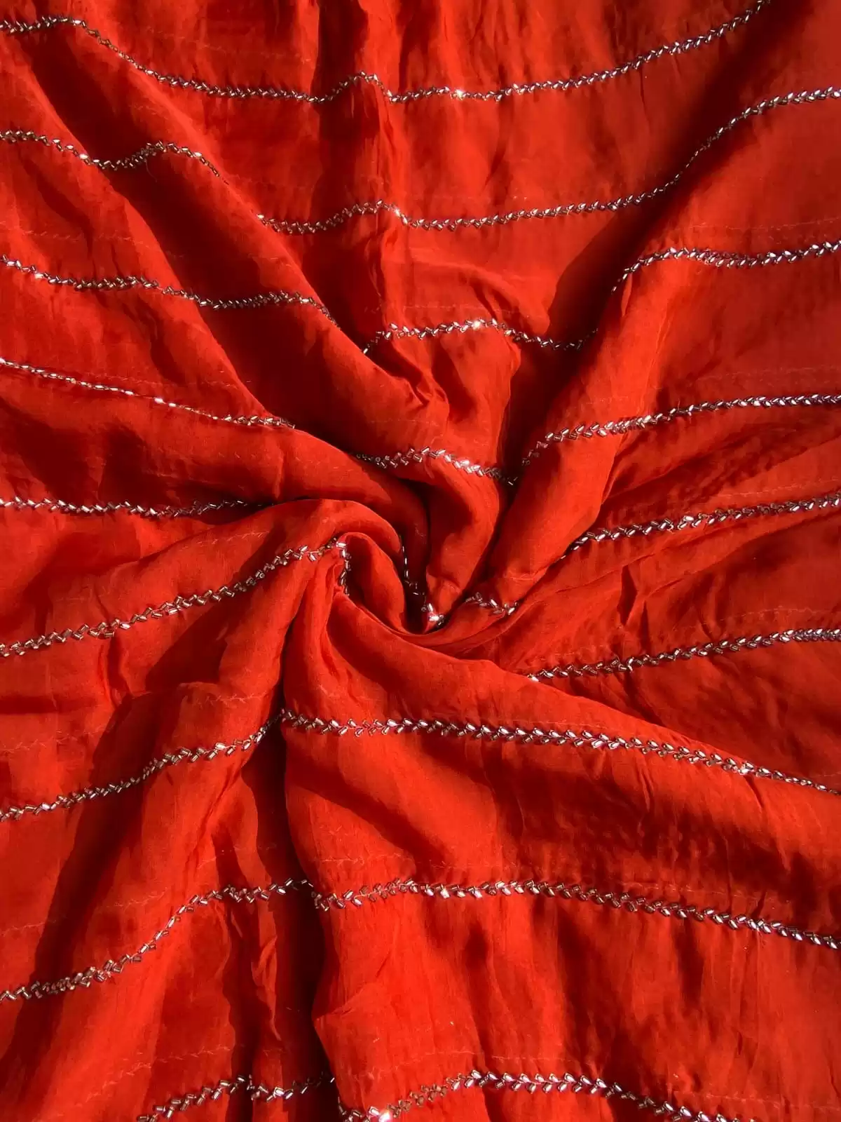 Hand embroidery in stripe Pattern on Rust orange pure organza fabric